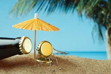 funny cork and bottle on a sandy beach