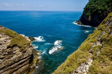 hidden beauty nature of kapas island located in malaysia, magical rock formation over blue sky background. selective focus image at sunny day