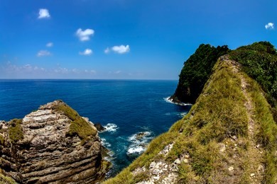 hidden beauty nature of kapas island located in malaysia, magical rock formation over blue sky background. selective focus image at sunny day