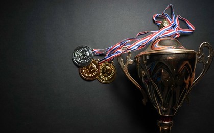 gold, silver and bronze medal with trophy