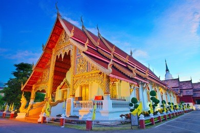 wat phra singh temple at sunset in chiang mai, thailand.
