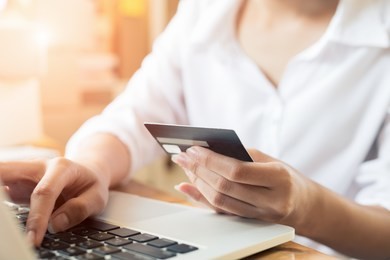 young asian women hands holding credit card for online shopping at home,teenager owner business,success and online shopping concept.