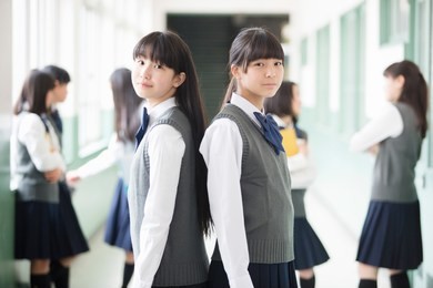 japanese students standing in a back-to-back