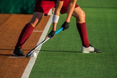 field hockey player, ready to pass the ball to a team mate