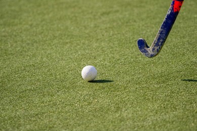 battle for control of ball during field hockey game