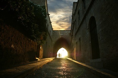 medieval avenue of the knights at night, a cobblestone street in rhodes citadel , greece