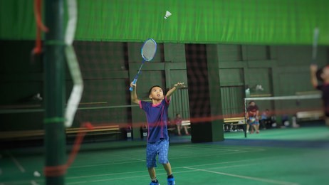 asian boy playing badminton.(selected focus)