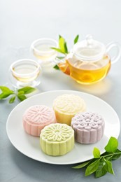 snow skin sweet and savory traditional chinese mooncakes with variety of fillings and green tea