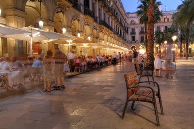 placa reial (royal plaza) in the old quater of barcelona, spain at night.