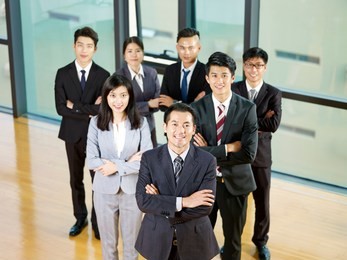 portrait of a successful asian business team led by a senior manager.