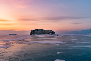beautiful sunrise sky over frozen water lake baikal siberia, winter season natural landscape background