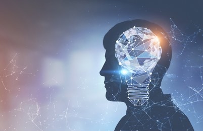 side view of businessman silhouette with a glowing polygons light bulb and network holograms over a blurred background. concept of a bright idea and creativity. toned image double exposure mock up