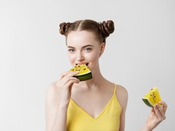 watermelon woman eating cute face happy summer portrait young beautiful model with yellow watermelon