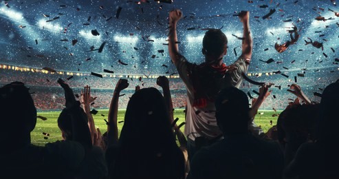 fans celebrating the success of their favorite sports team on the stands of the professional stadium while it's snowing. stadium is made in 3d.