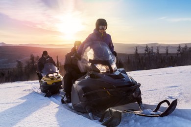 walk on snowmobiles in the mountains of the urals.