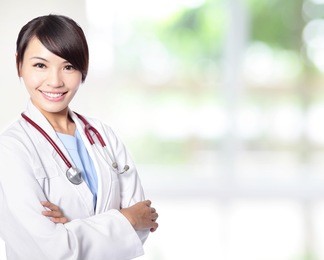 young doctor woman smile face with stethoscope with nature green background, model is a asian female
