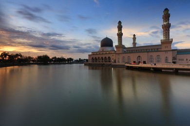 beautiful view of bandaraya kota kinabalu mosque (masjid bandaraya mbr) at likas, kota kinabalu, sabah during sunset.