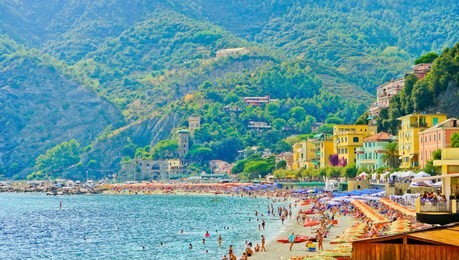 view of the seaside of monterosso village in summer in the cinque terre area, italy.