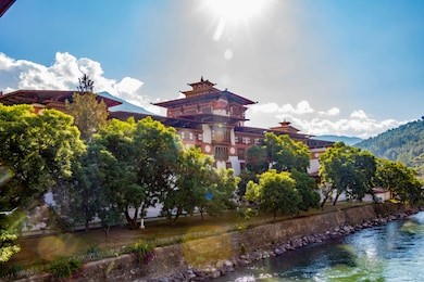 punakha dzong against a strong sun