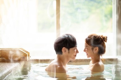 young couple relaxing in hot springs 