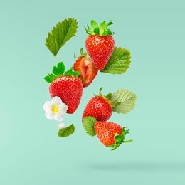 flying fresh tasty ripe strawberry with green leaves at turquoise background.  food levitation concept. creative food layout, high resolution image