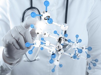 scientist doctor hand touch virtual molecular structure in the lab