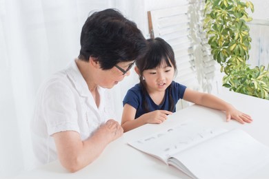 asian family reading story book