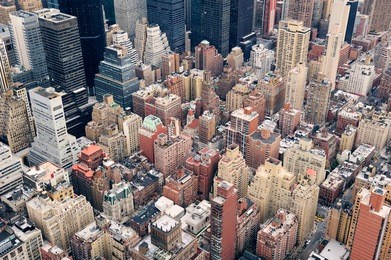 new york city manhattan street aerial view with skyscrapers, pedestrian and busy traffic.