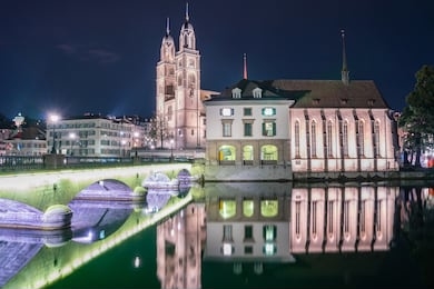view of grossmunster and zurich old town from limmat river. the grossmunster is a romanesque-style protestant church in zurich, switzerland.