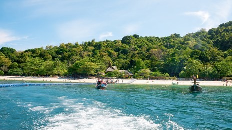 banana beach on coral (koh he) island on a sunny day, phuket, thailand. the picture aspect ratio is 16:9 