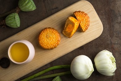 moon cakes are offered to friends or on family gathering during the mid-autumn festiva. mooncake and tea 