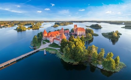 trakai castle: medieval gothic island castle, located in galve lake. flat lay of the most beautiful lithuanian landmark. trakai island castle - one of the most popular tourist destination in lithuania