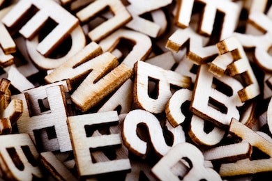 jumbled wooden letters close up