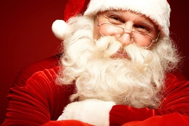 photo of happy santa claus in eyeglasses looking at camera