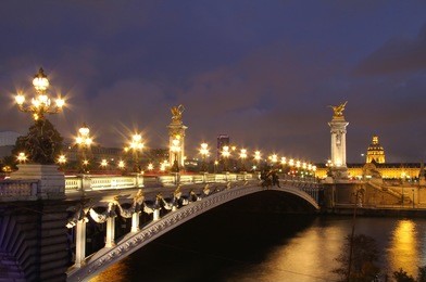 pont alexandre iii and hotel des invalides at evening. paris night scenes