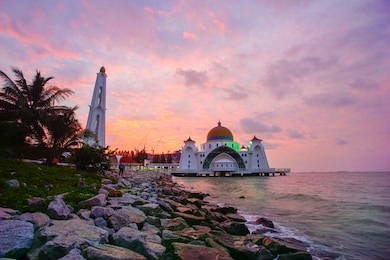 majestic view of malacca straits mosque during sunset.