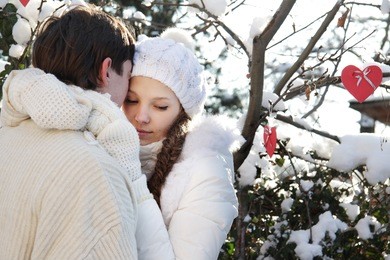 young loving couple on natural winter background