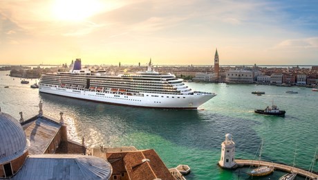 oversized cruise ship brings thousands of tourists to venice, italy