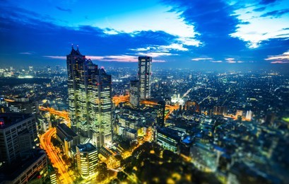 asia business concept for real estate and corporate construction - panoramic modern city skyline aerial night view of shinjuku in tokyo, japan. miniature lens tilt shift blur effect 