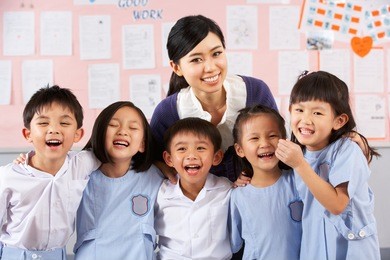 portait of teacher and students in chinese school classroom