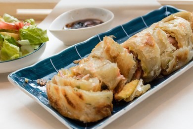 traditional chinese food, taiwanese fried pancake with bacon and cheese filling
