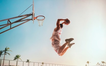 streetball. basketball player in action on sunset. basketball players play in streetbol.