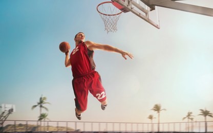 streetball. basketball player in action on sunset. basketball players play in streetbol.