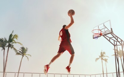 streetball. basketball player in action on sunset. basketball players play in streetbol.