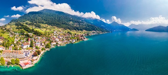 village weggis, lake lucerne (vierwaldstatersee), pilatus mountain and swiss alps in the background near famous lucerne (luzern) city, switzerland