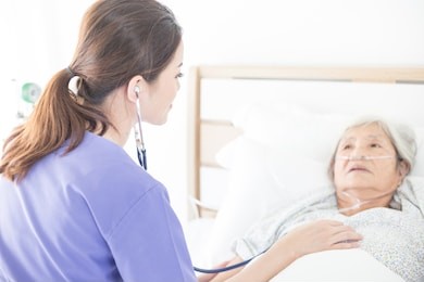 nurse screening old asian patient , she explain about disease symptom,   elderly health check up , palliative care