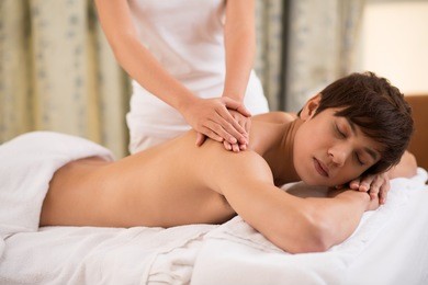 handsome guy relaxing in massage room