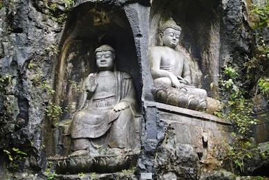rock reliefs or rock carving at feilai feng or feilai grottoes in lingyin temple, hangzhou, zhejiang, china. the temple's name is translated as temple of the soul's retreat. 
