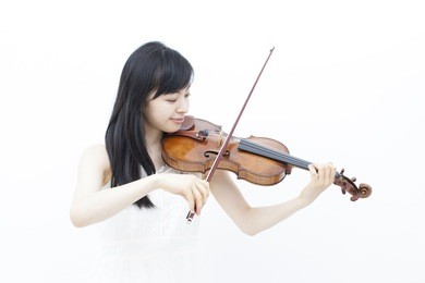 beautiful girl playing the violin, isolated on white background