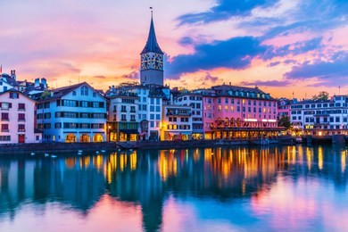 scenic summer sunset view of the old town pier architecture and limmat river embankment in zurich, swizerland